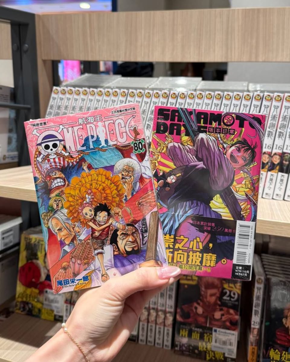 A vibrant display of manga and graphic novels at Kinokuniya, showcasing a diverse range of titles and series.