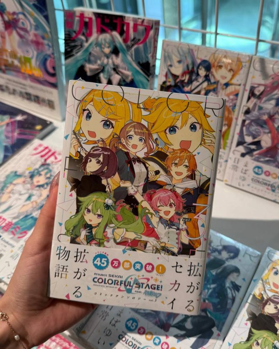 Customers browsing various book sections in a spacious and brightly lit Kinokuniya bookstore.