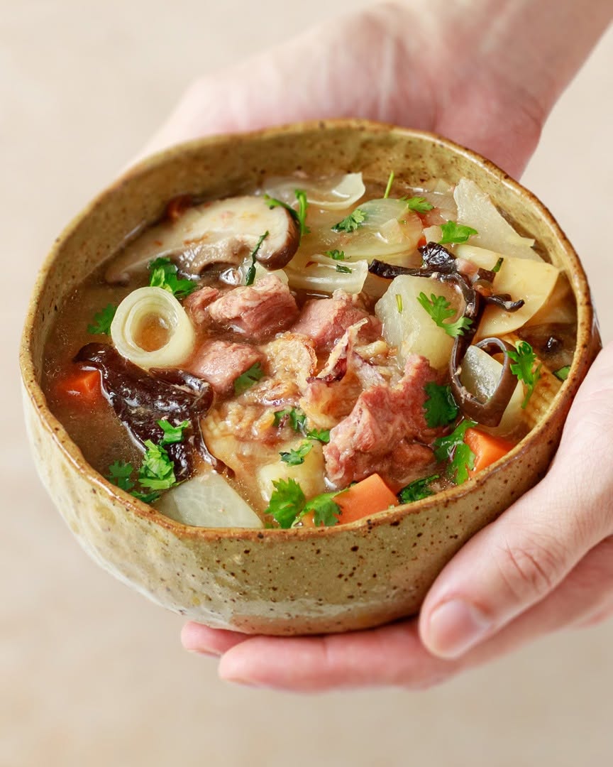 Hearty stew with pork, carrots, and mushrooms
