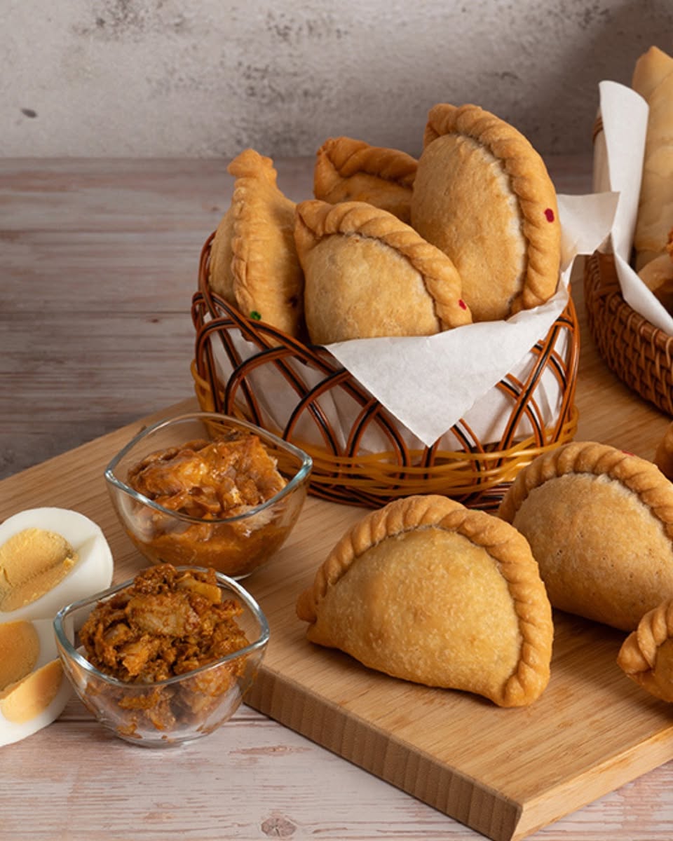 Golden brown curry puffs, a popular Singaporean snack