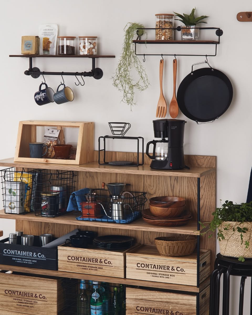 Container and Co storage boxes with coffee maker, cookware, and potted plants