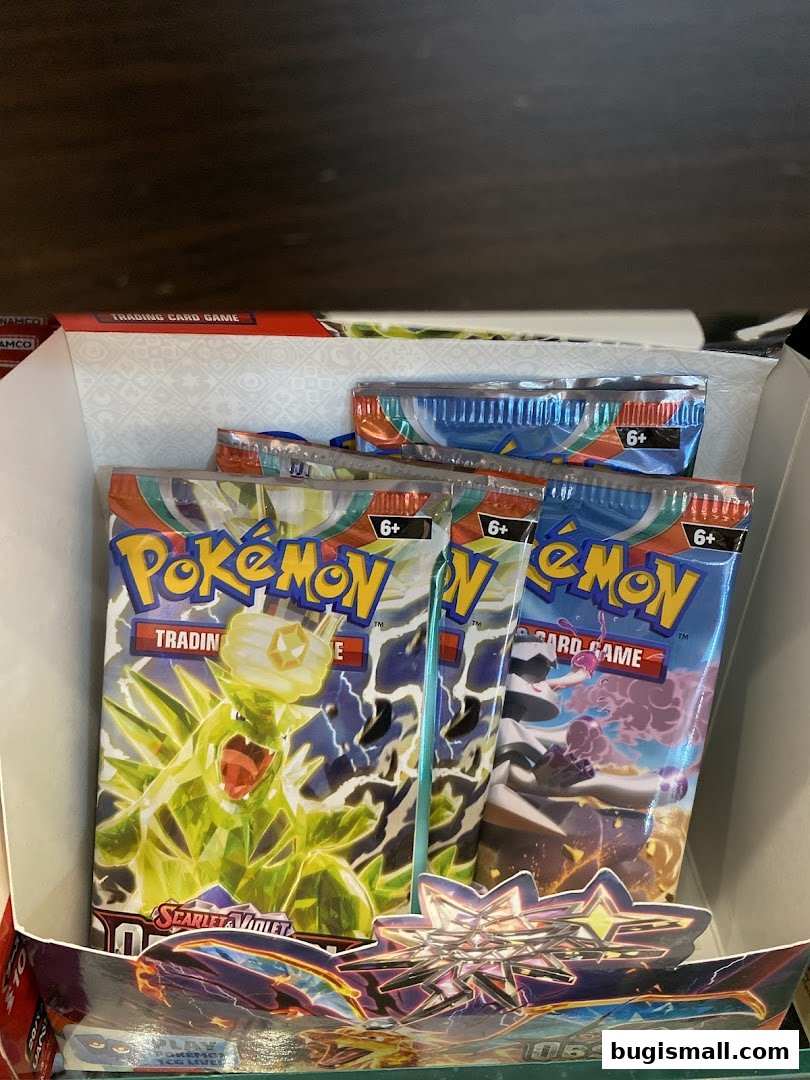 Packs of Pokemon trading cards, including Scarlet & Violet, are displayed in a retail setting.