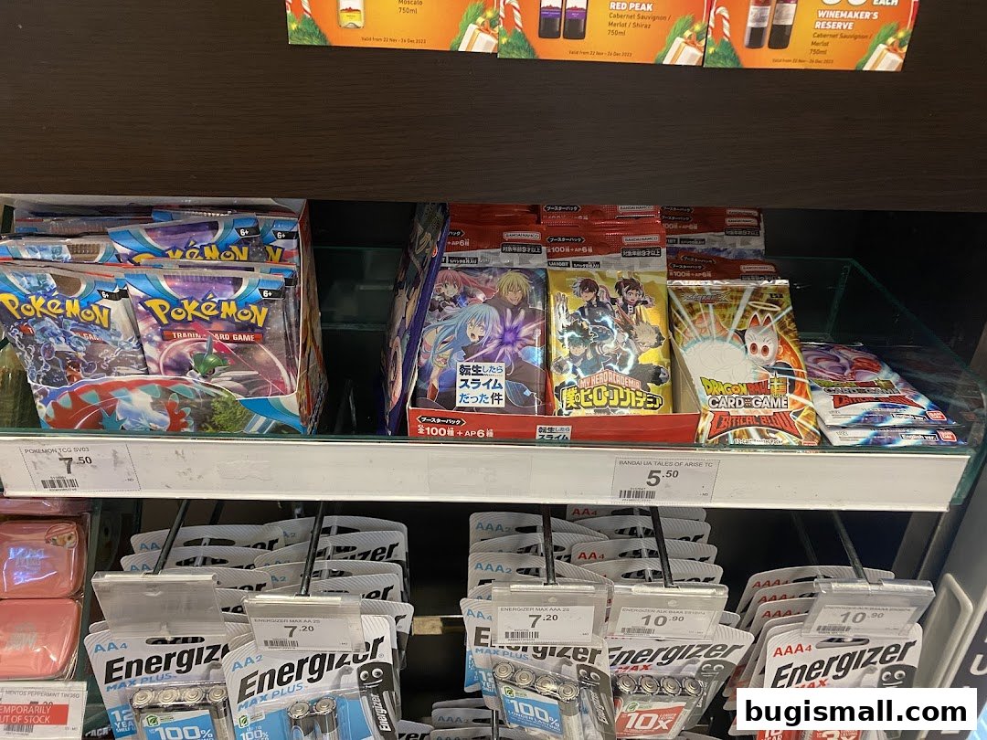 Shelves stocked with trading card game packs and batteries at a 7-Eleven store.