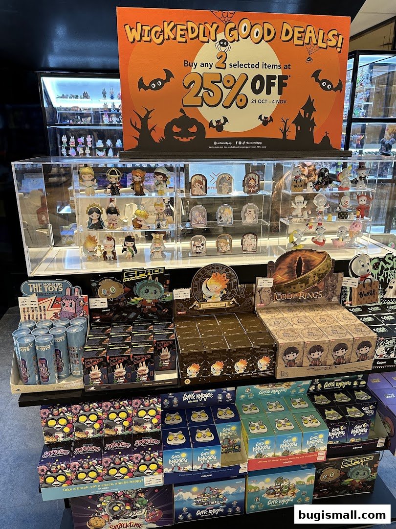 A display of collectible toys and merchandise with a Halloween-themed promotional banner.
