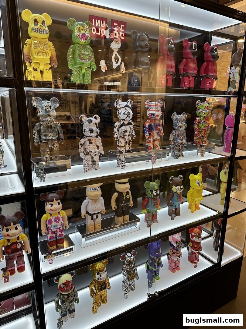 Display case filled with various collectible designer toys, including Bearbrick figures.