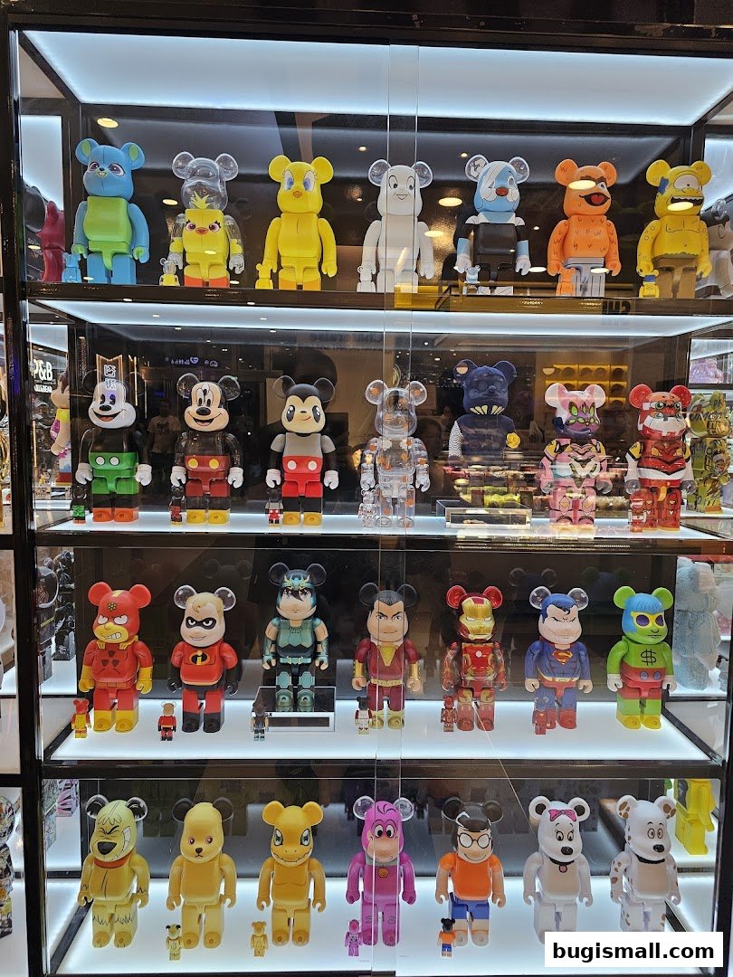A display case filled with various collectible designer toys, many resembling cartoon characters.