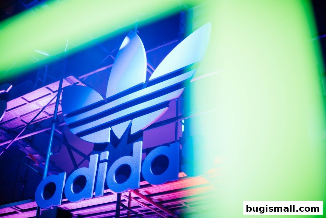 Close-up of the illuminated Adidas Originals logo with neon lighting.