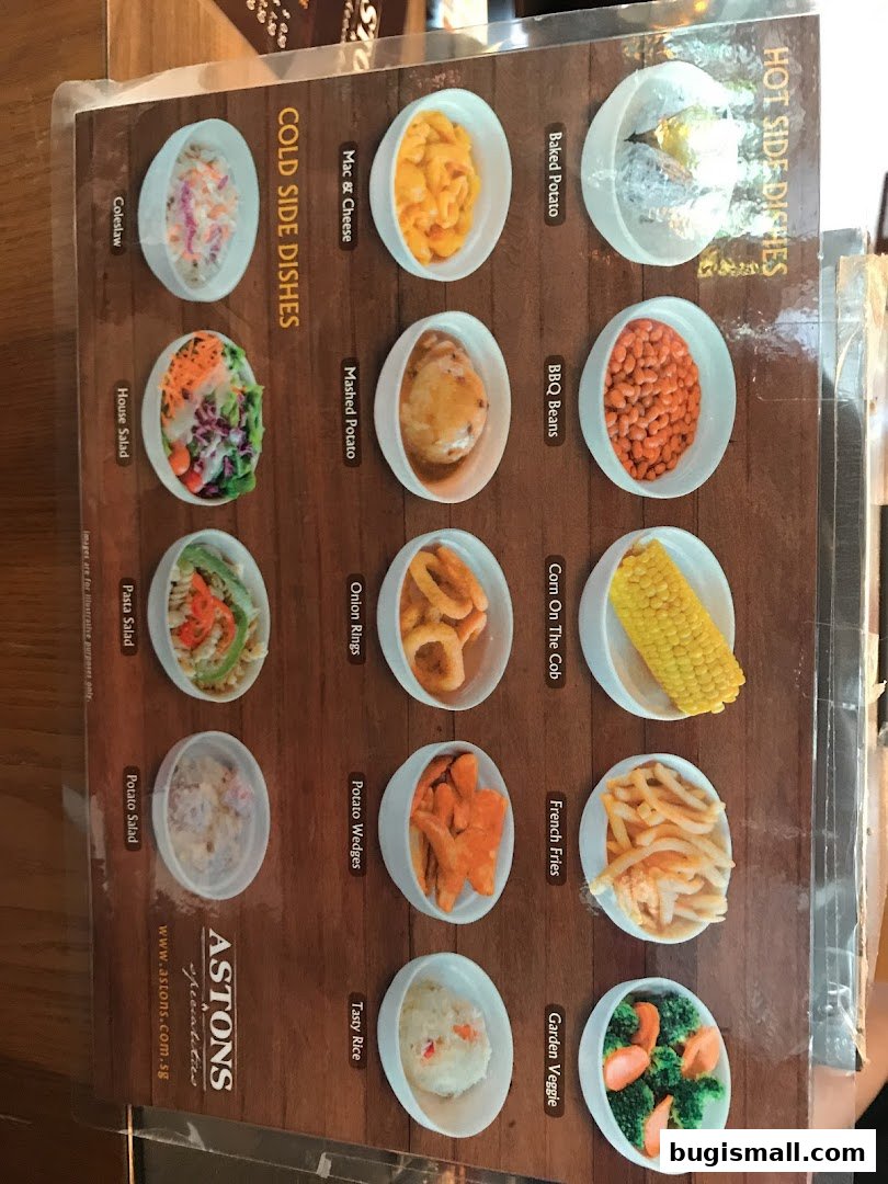 A menu from ASTONS featuring a variety of hot and cold side dishes with accompanying images.