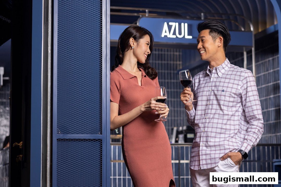 A couple enjoys wine at AZUL GV Bugis, with the shop's name visible.