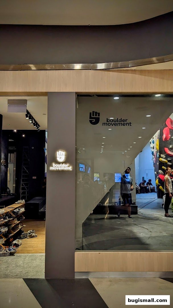 The entrance to Boulder Movement, a bouldering gym, with climbing walls visible inside.
