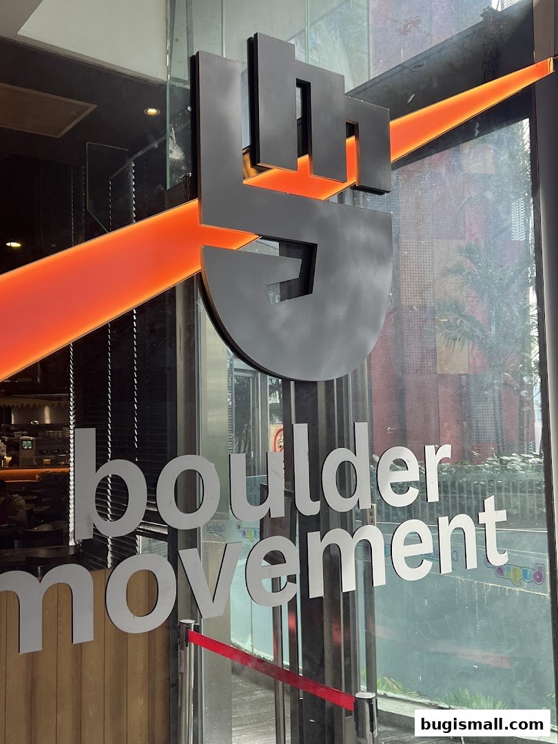 The entrance to Boulder Movement Bugis, featuring its logo and name on the glass door.