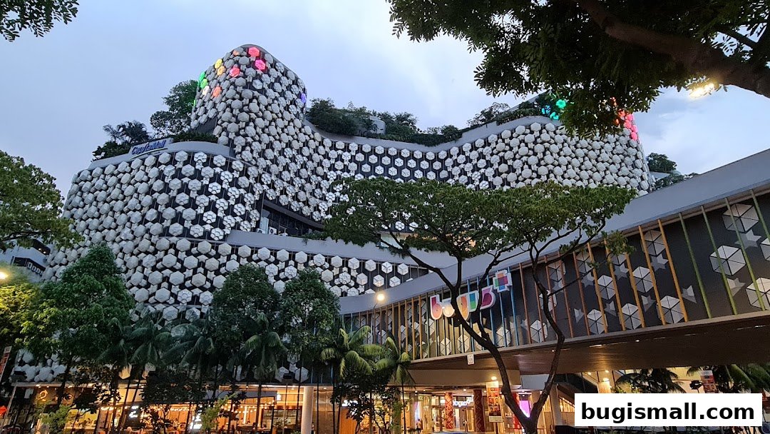 A striking modern building with a unique honeycomb facade and colorful lights.