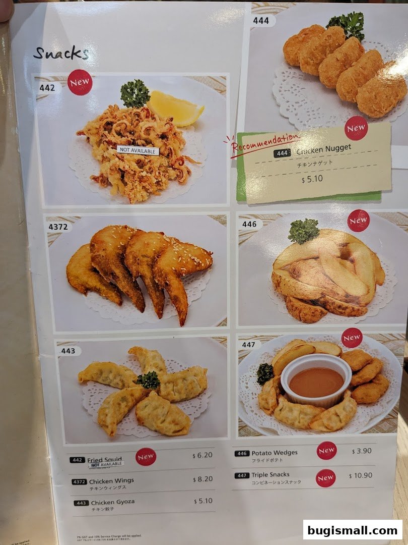 A menu page showcasing various snacks like fried squid, chicken wings, gyoza, nuggets, and potato wedges.