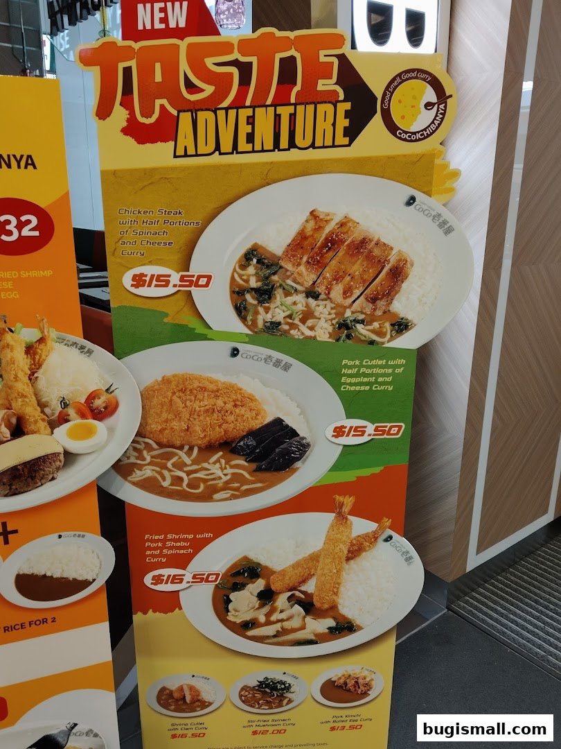 A display board showcasing various Japanese curry dishes from CoCo Ichibanya.