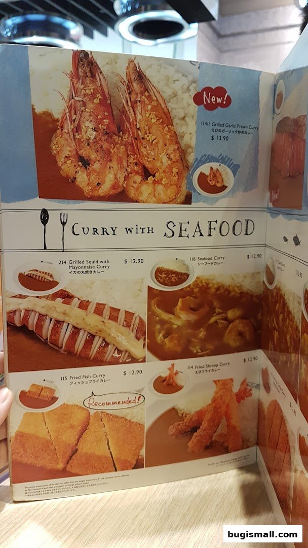 A menu featuring various seafood curry dishes with appetizing images and descriptions.