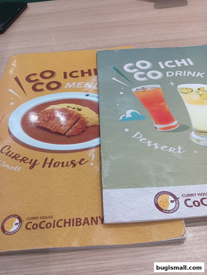 Two menus from CoCo Ichibanya, one featuring curry and the other drinks and desserts.