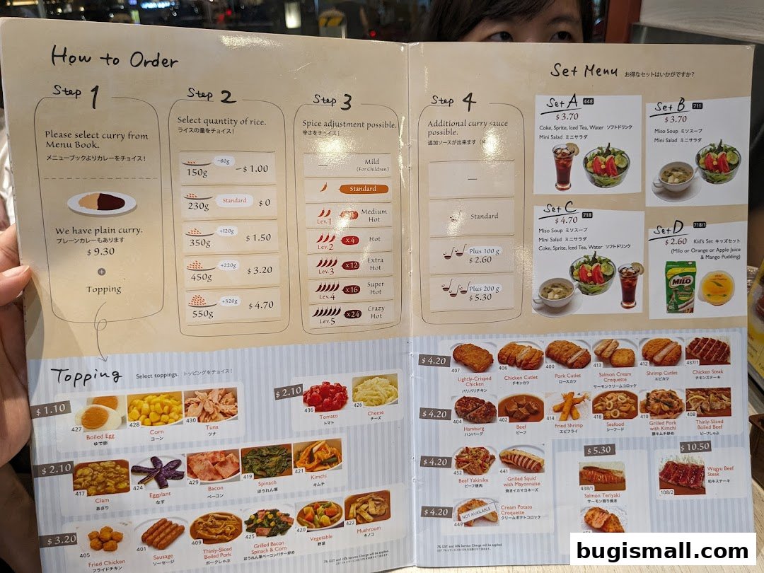 A menu from CoCo Ichibanya showing how to order, set menus, and various toppings and side dishes.