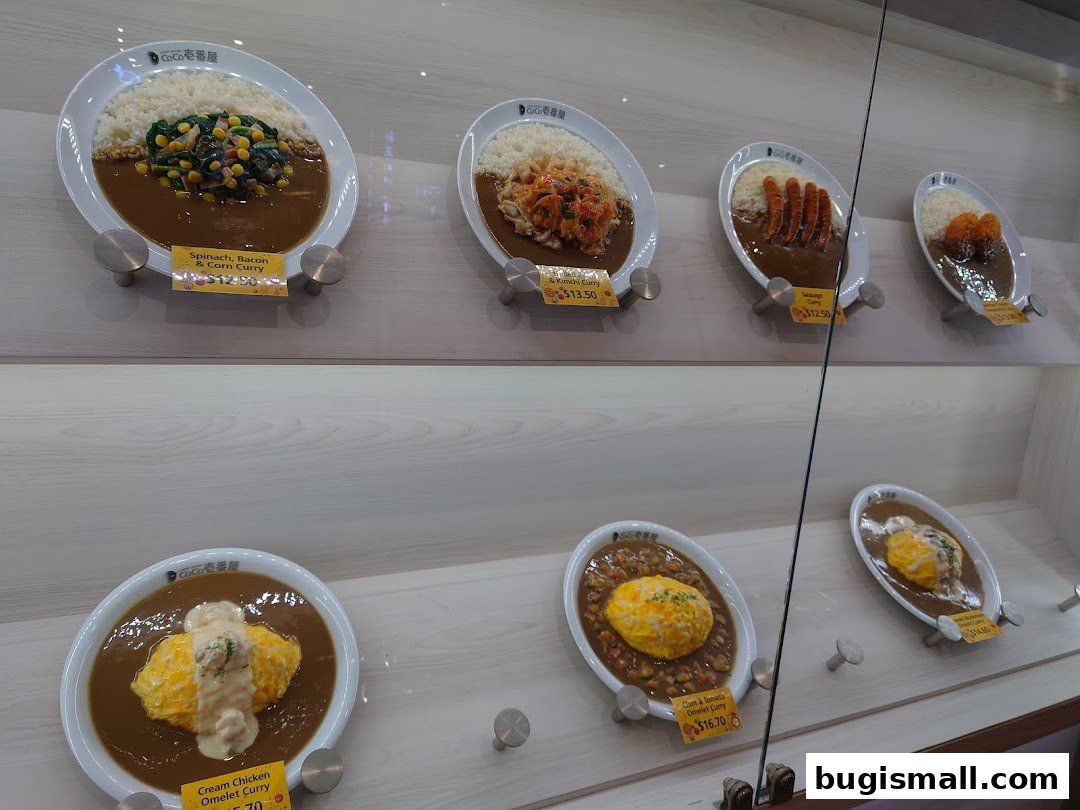 Display of various Japanese curry dishes with rice and toppings.