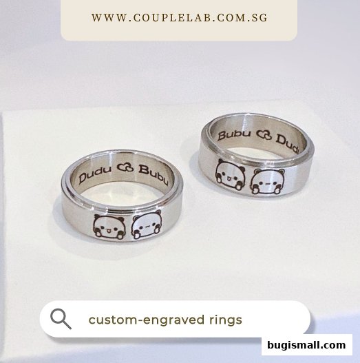 Two silver rings with cute panda engravings and personalized text.