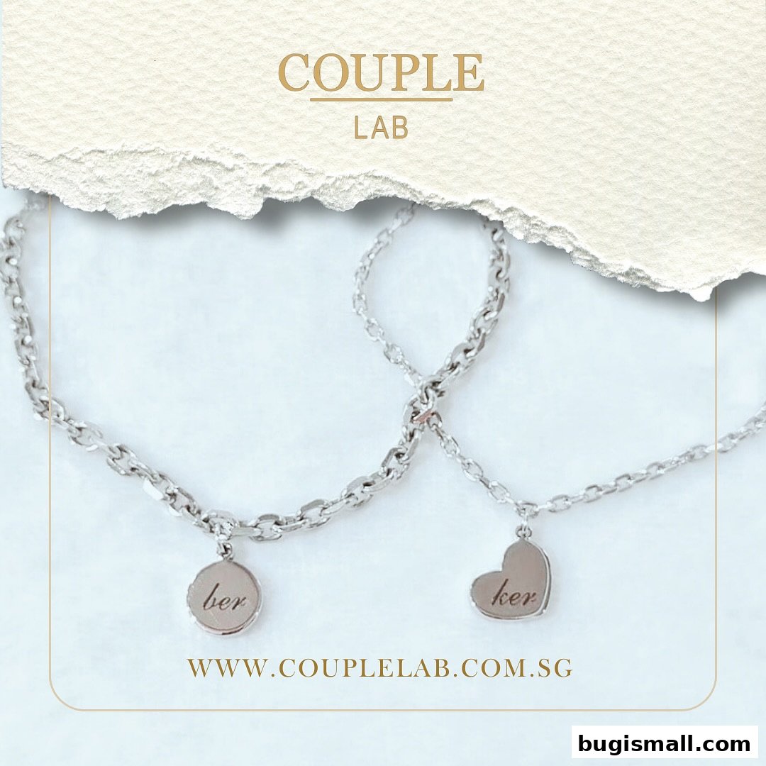 Couple Lab showcases matching necklaces with 'her' and 'ker' pendants.