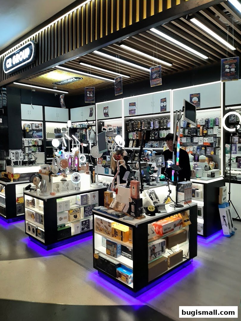 Interior view of a modern electronics store showcasing various gadgets and accessories on display.