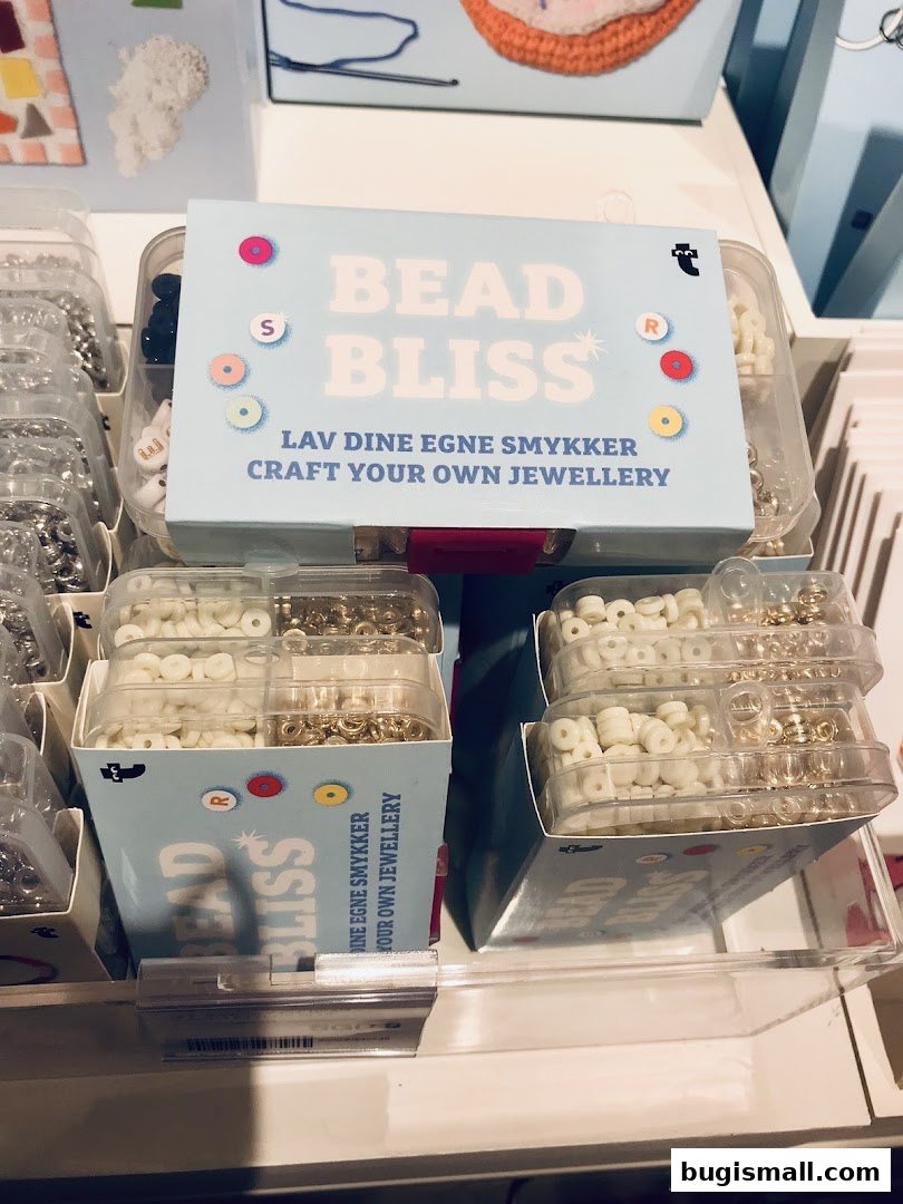 Boxes of beads and jewelry making supplies are displayed on shelves.