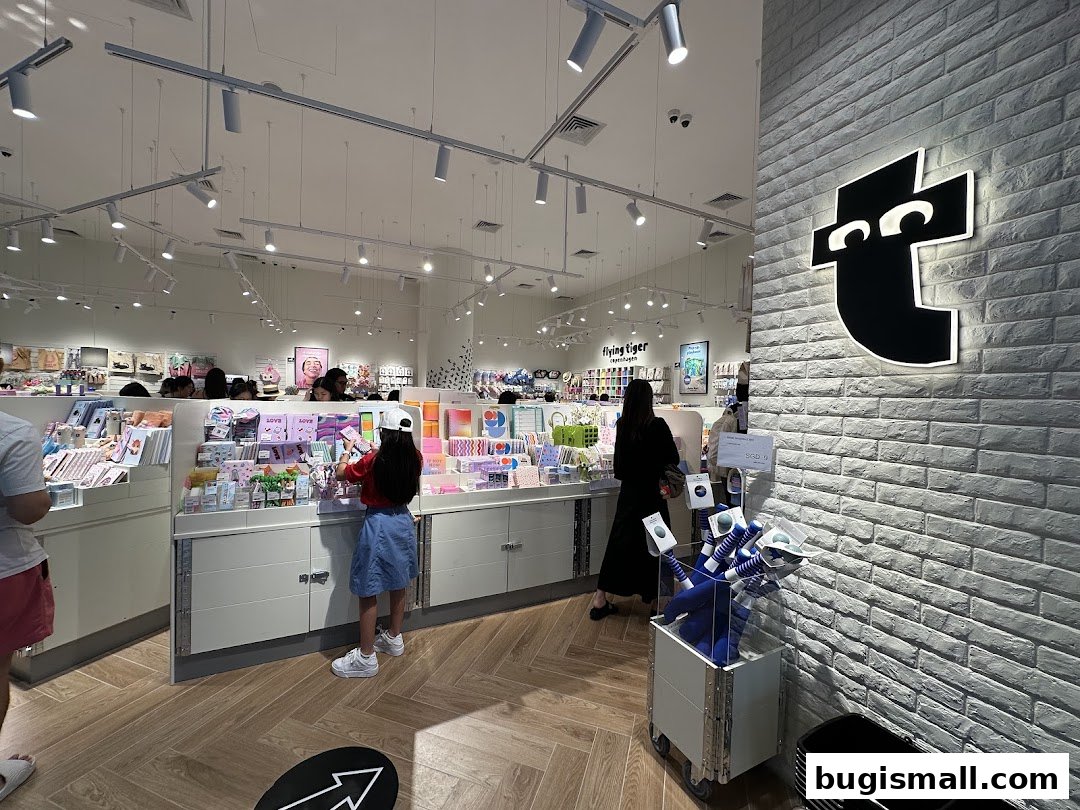 Interior of a Flying Tiger Copenhagen store with customers browsing colorful merchandise.