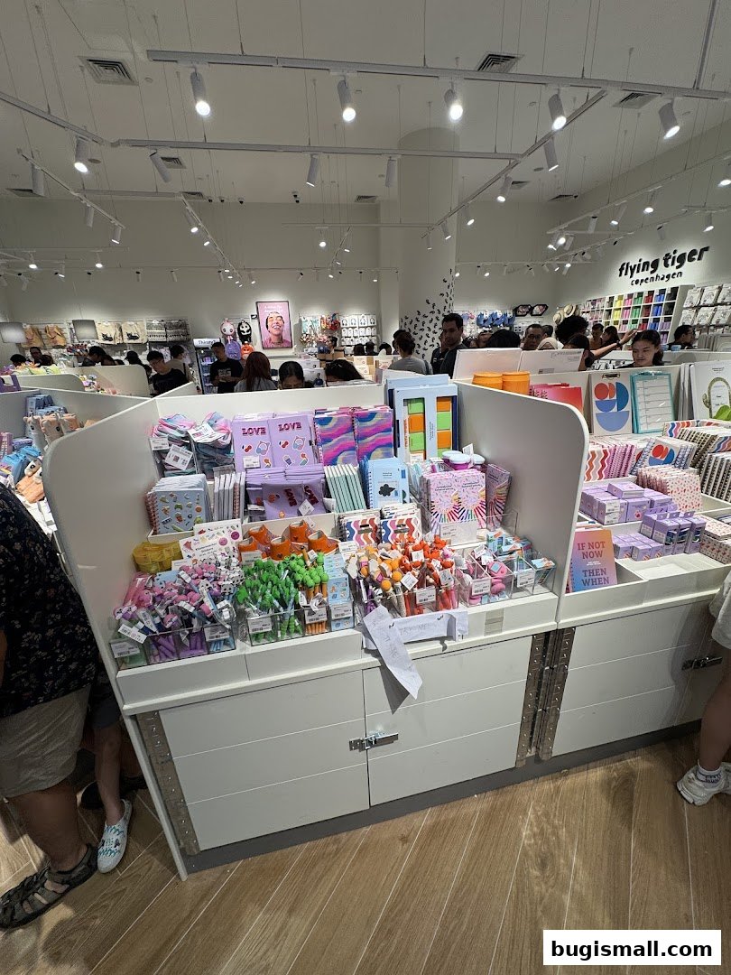 Interior view of a Flying Tiger Copenhagen shop with colorful stationery and gifts on display.