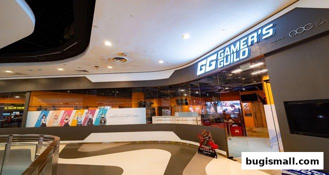 The entrance of Gamers Guild, a gaming store with bright signage and anime-themed decor.