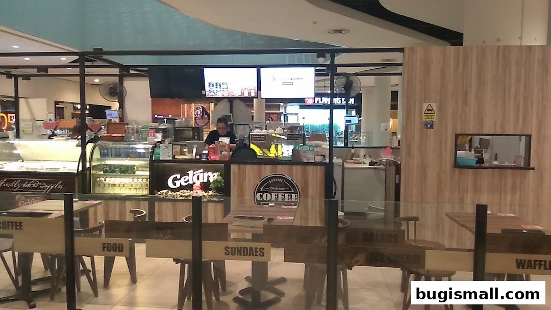 Geláre Bugis shop with ice cream displays, coffee counter, and seating area.