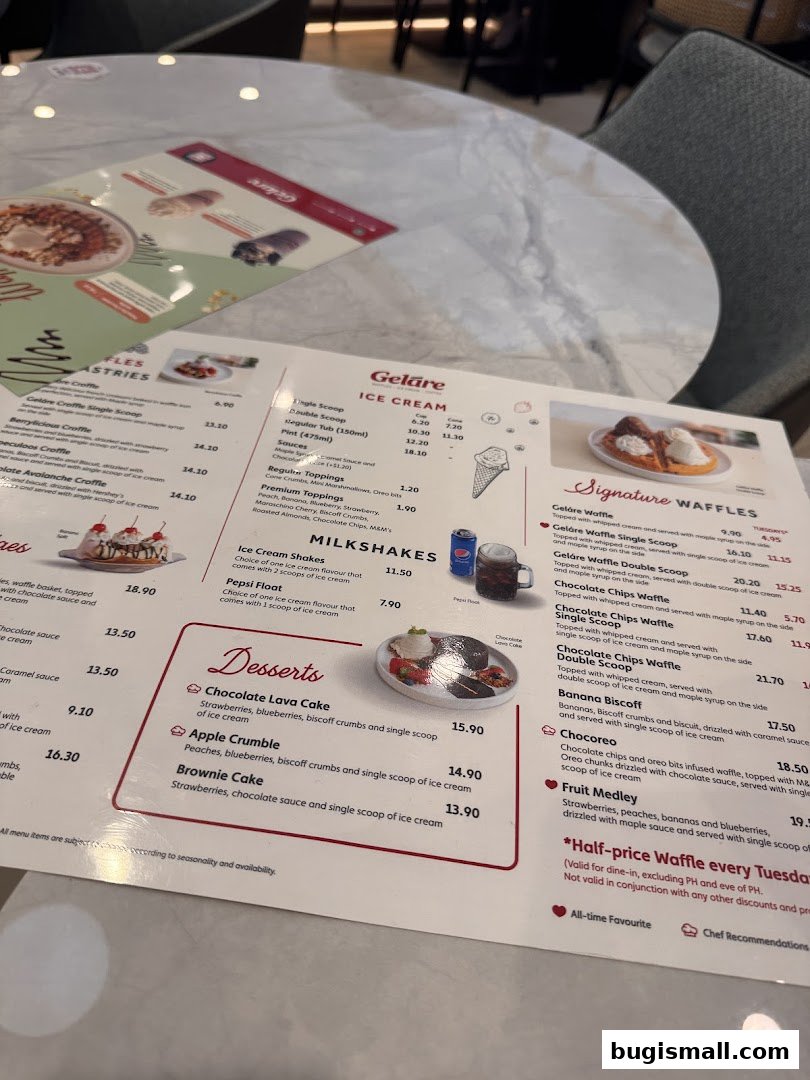 A menu from Geláre Bugis featuring ice cream, milkshakes, desserts, and waffles.