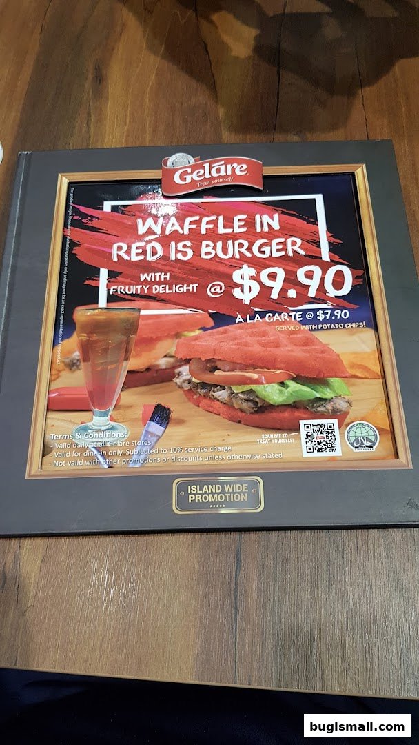 A menu item from Geláre featuring a red waffle burger with fruity delight.