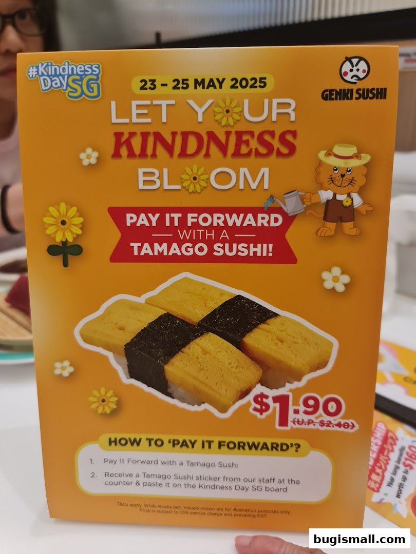 A promotional sign for Genki Sushi offering Tamago Sushi for Kindness Day.