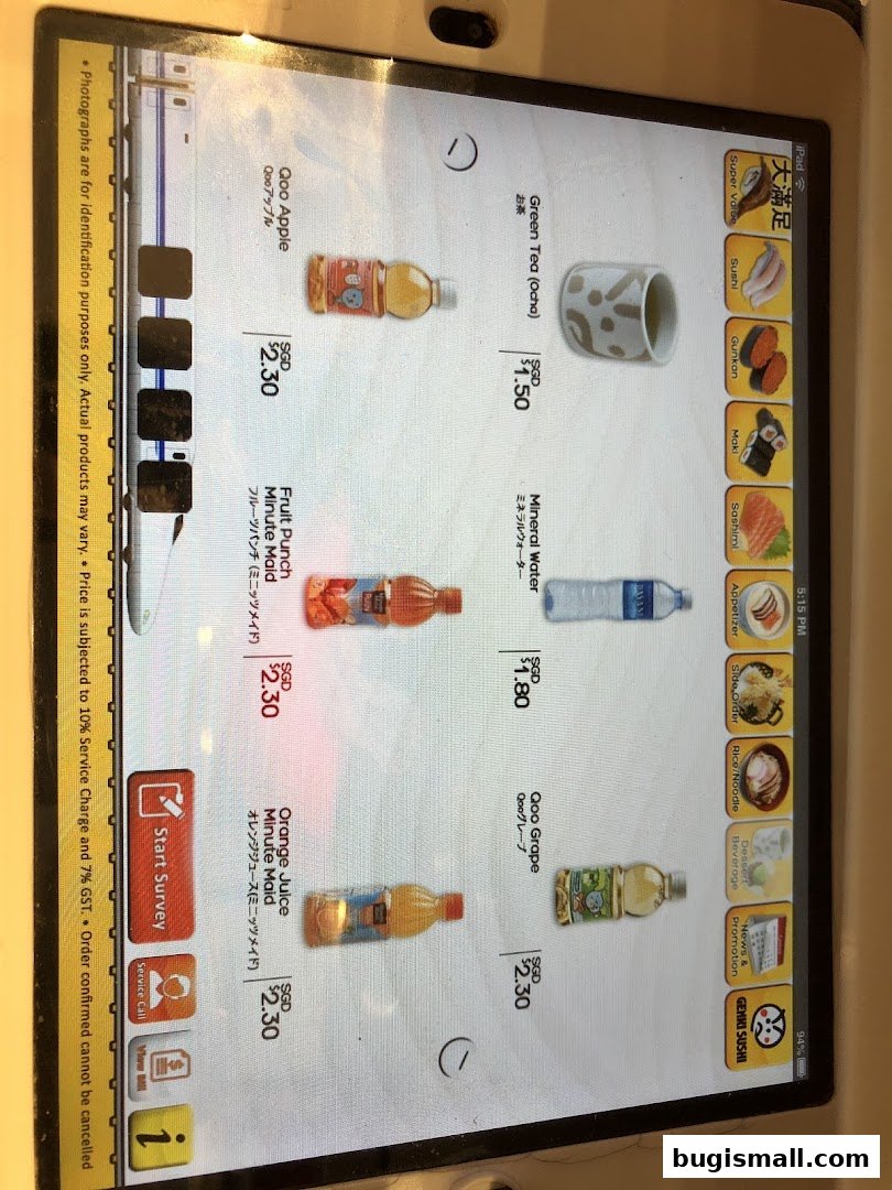 A tablet screen displaying a menu of drinks and sushi categories for Genki Sushi.