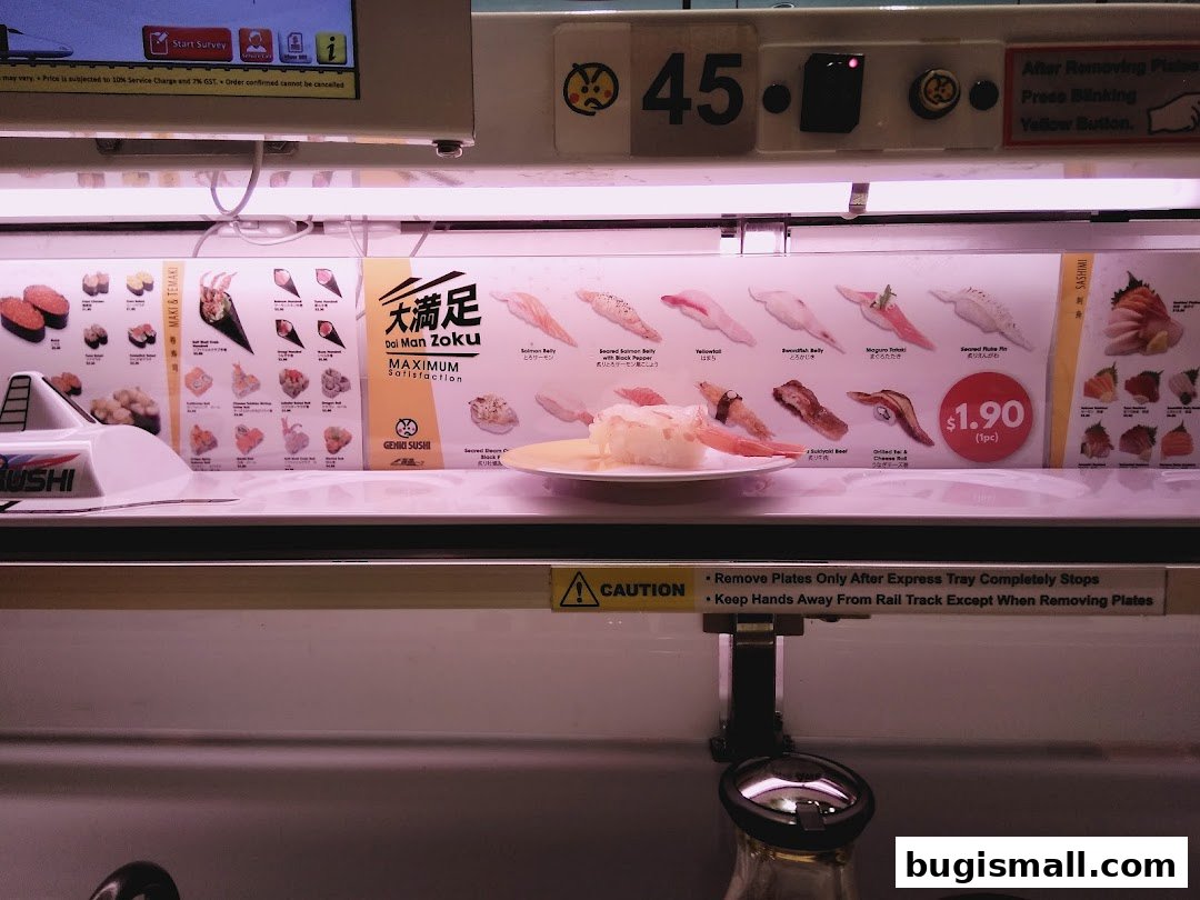 A conveyor belt sushi restaurant with various sushi dishes displayed and a price tag of $1.90.