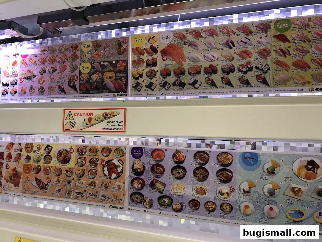 A display of various sushi, sashimi, and other Japanese dishes with prices.