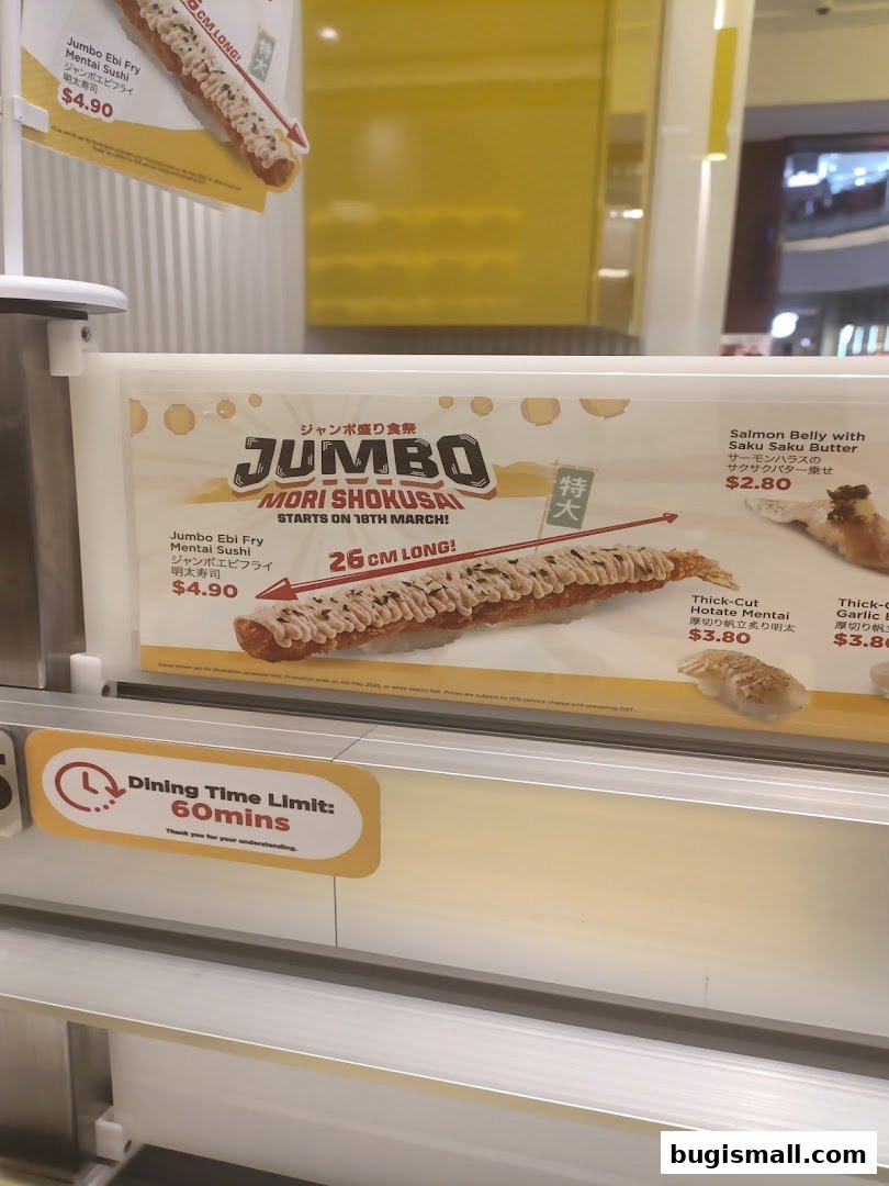 A display of sushi items with prices and descriptions, featuring a large jumbo sushi roll.