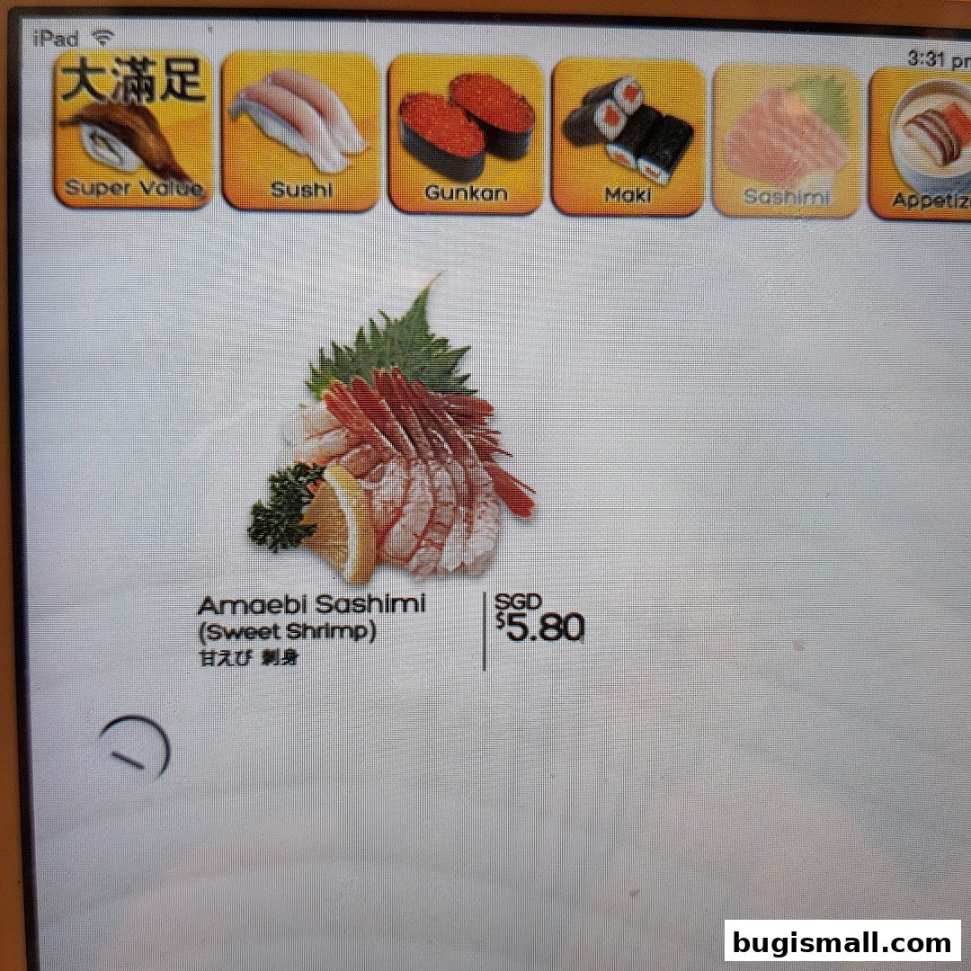 A digital menu displaying various sushi options, featuring Amaebi Sashimi.