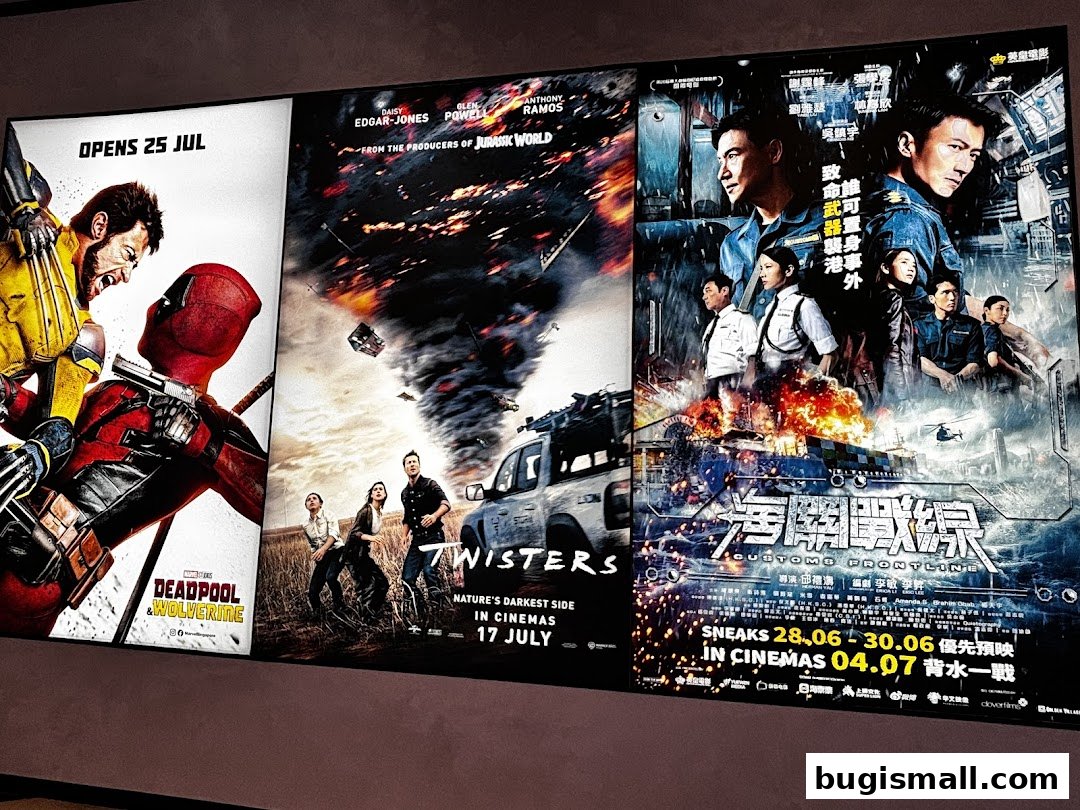 Movie posters for Deadpool & Wolverine, Twisters, and Customs Frontline displayed on a screen.