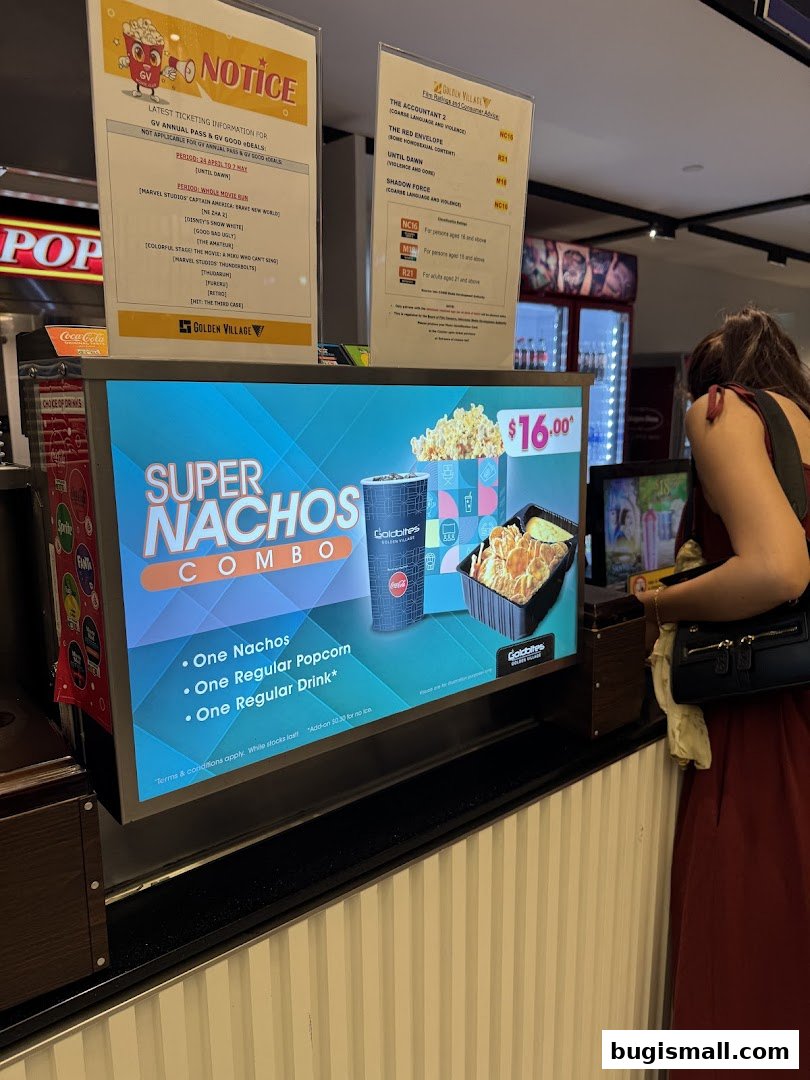 A display advertises a Super Nachos Combo at Golden Village cinema.