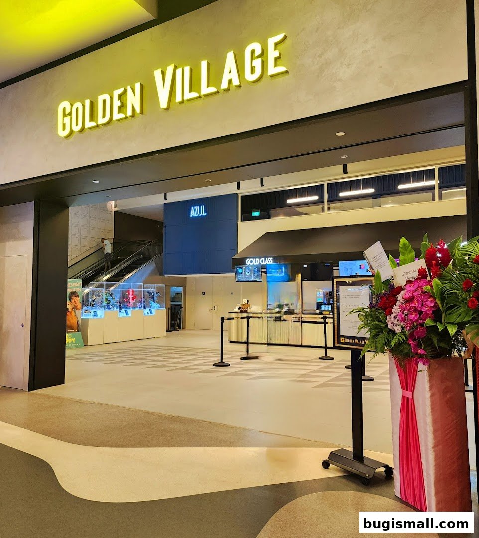 The entrance to Golden Village cinema, featuring a prominent sign and a ticket counter.