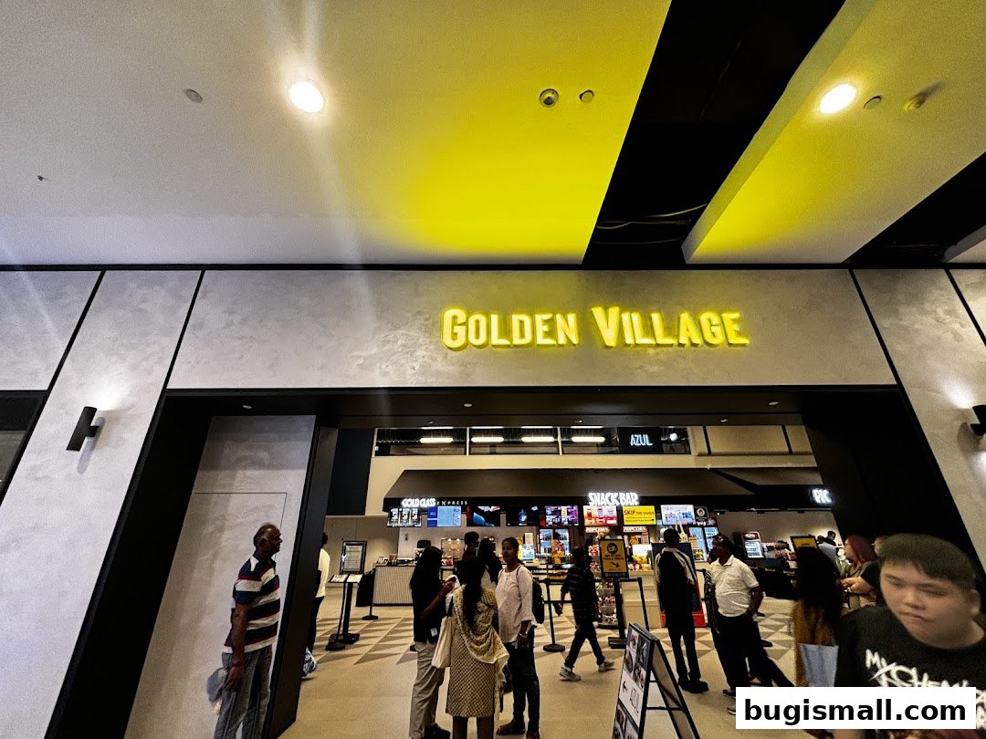 The entrance to Golden Village cinema with people queuing at the snack bar.