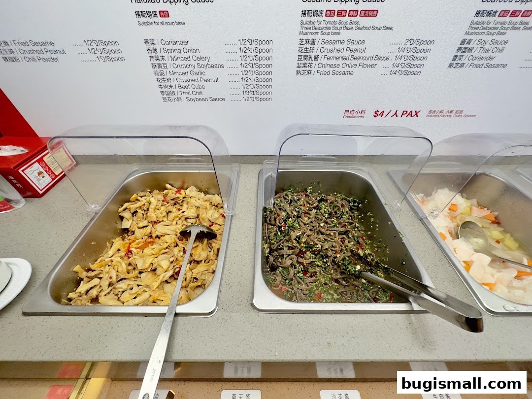 A selection of condiments and dipping sauces available at Haidilao Hot Pot.
