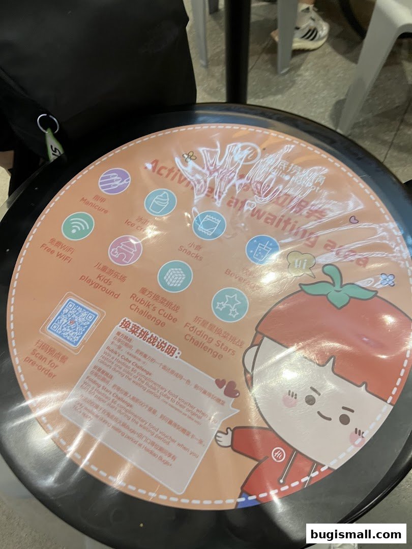 A table mat at Haidilao Hot Pot Bugis featuring activities and challenges for waiting customers.