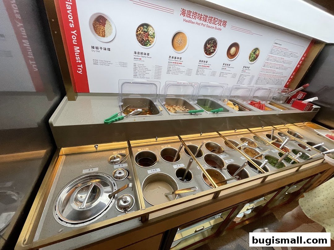 A display of various dipping sauces and ingredients for hot pot at Haidilao.