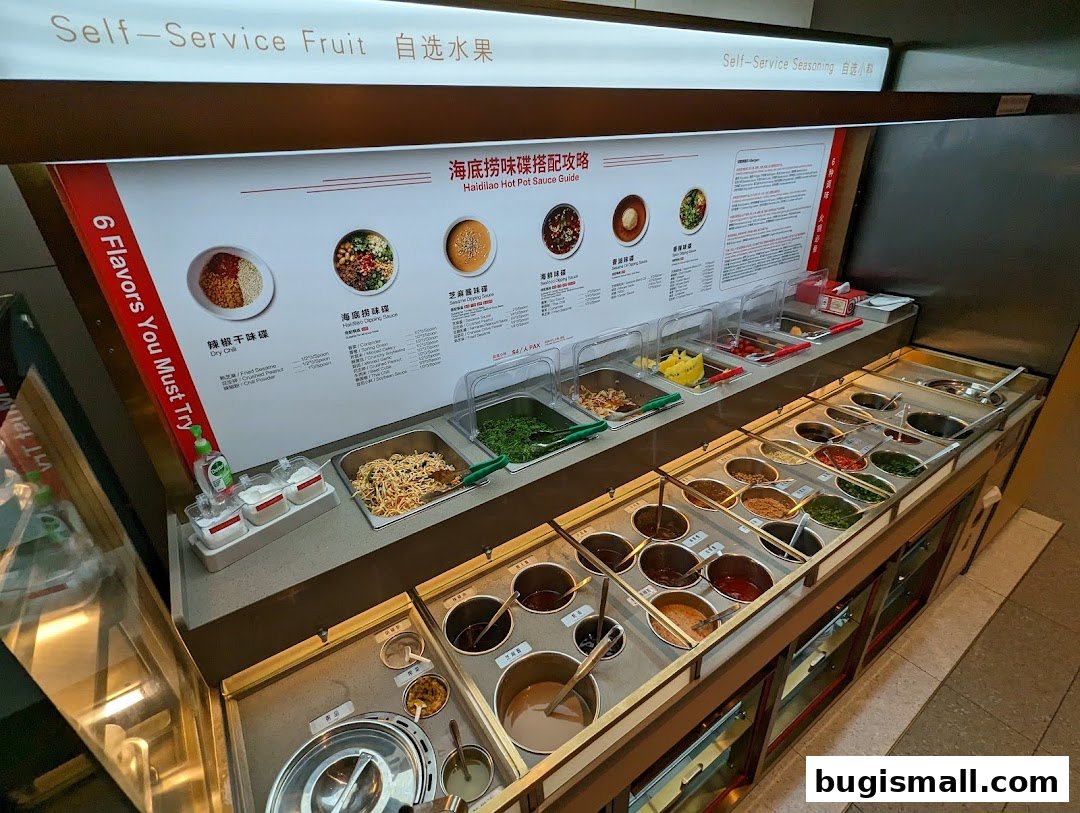 A self-service station with various ingredients for hot pot dipping sauces.