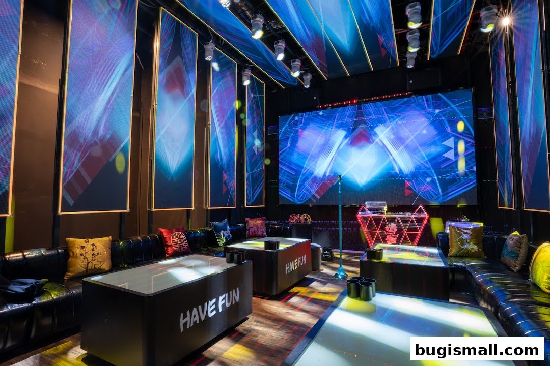A modern karaoke room with plush seating, large screens, and vibrant lighting.