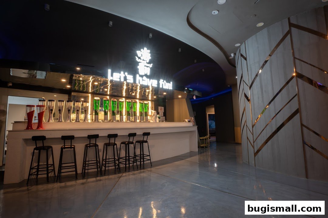 A bar area with multiple drink dispensers and stools at HaveFun Karaoke Bugis Plus.