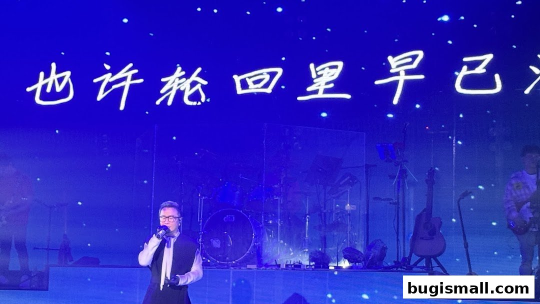 A singer performs on stage with a band and a large screen displaying Chinese characters.