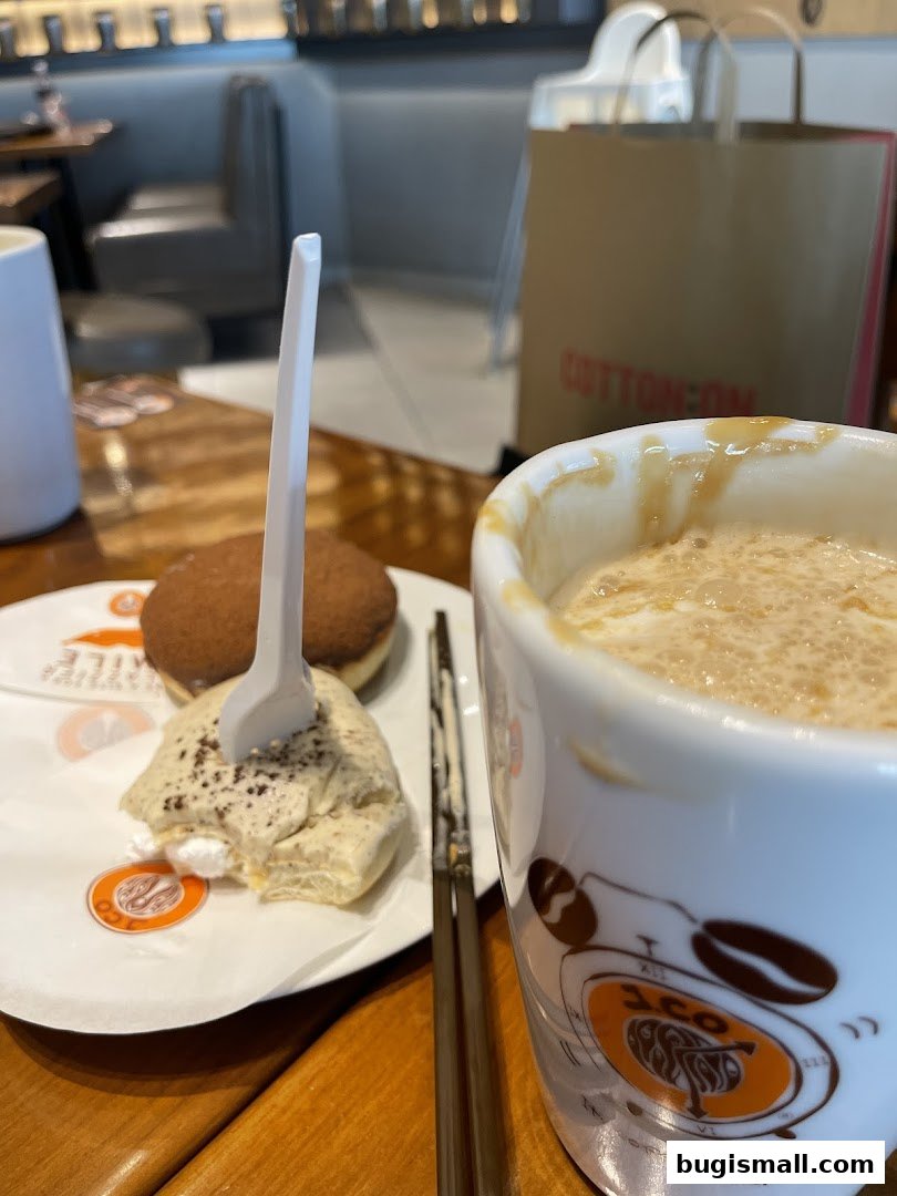 A close-up of a coffee and donut from J.CO Donuts & Coffee.